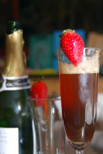 Sparkling wine cocktail with cherry heering liqueur and strawberry