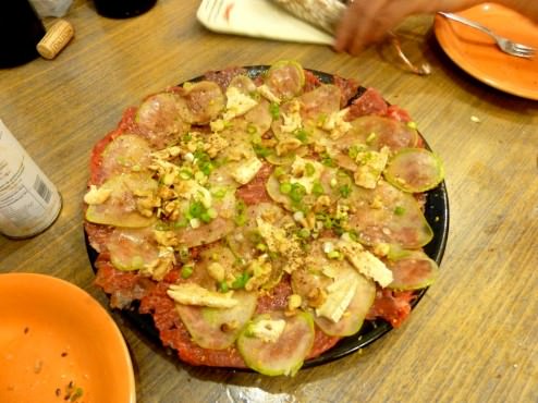 Pears, ripe brie cheese, nuts and green onions. carpaccio