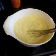 mixing over heat cornflour, eggs, cream...