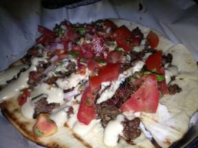 Lamb "siniyeh" on a lafa baked with tahini, tomatoes and parsley (48 NIS). It was more like a dish called "lahmajun" than a siniyeh because the meat wasn't cooked inside the tehini, but only spread on top afterwards. Nonetheless it was tasty.