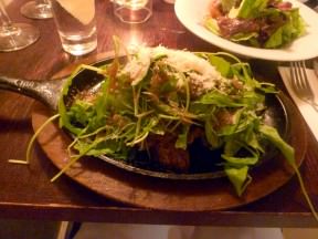 Rokach steak - seared veal chunks served on a hot iron pan, arugula, balsamic vinaigrette and parmesan. The disappointment of the meal came as thin slices of meat - too thin and covered with a blanket of greens. Serving on a sizzling pan over-cooked the meat.