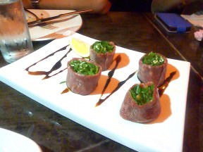 Carpaccio flowers: Filet of beef, arugula, baby greens and parmesan on balsamic vinegar. One of NG's flag dishes.