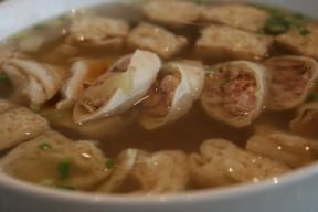 Vermicelli soup with deep fried bean curd and minced meat rolls.