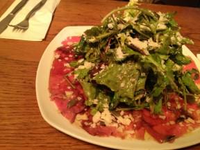 Carpaccio Salad, green salad, pomegranate vinaigrette, sirloin carpaccio with parmesan and pumpkin seeds (43 NIS).