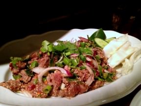 Naam-Tuk: Spicy raw beef salad with green onions, cilantro, lemon grass, shallots, mint, chili, roasted rice and lemon (43 NIS).