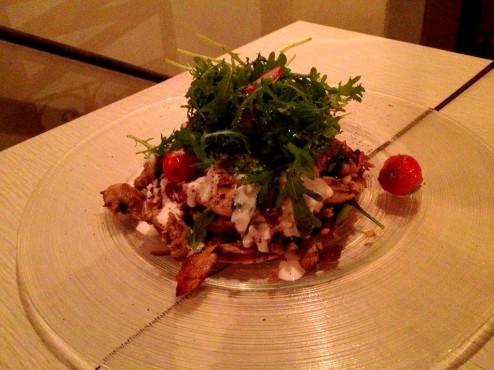 "Mosahen"- chicken confit on a lafa with cherry tomatoes, fava beans, red onions and yogurt (58 NIS).