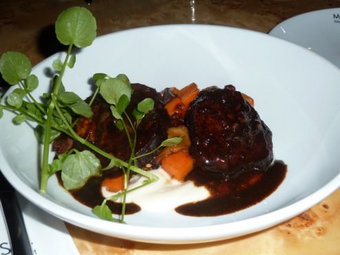 Veal cheek, root vegetables cream and crispy gnocchi with sweet spices broth (128 NIS)