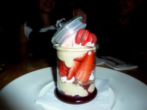 Wild berries dessert (62 NIS) is a layered dessert served inside a clear tall glass. There's strawberry sorbet, meringue, pastry cream, fresh strawberries, strawberry marmalade and strawberry macaroons.
