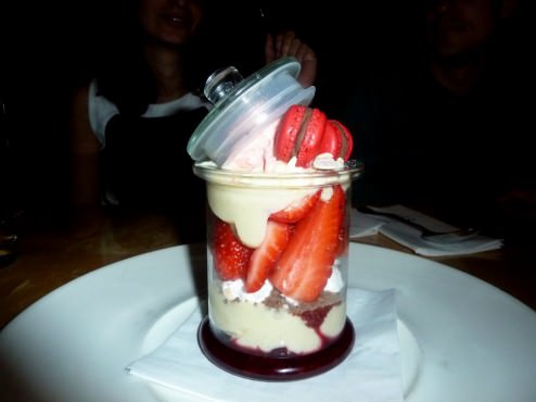 Wild berries dessert (62 NIS) is a layered dessert served inside a clear tall glass. There's strawberry sorbet, meringue, pastry cream, fresh strawberries, strawberry marmalade and strawberry macaroons.